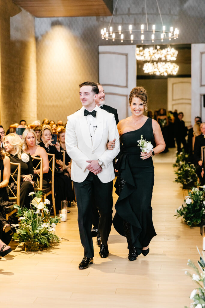 groom walking down the aisle with his mother at Cescaphe wedding ceremony