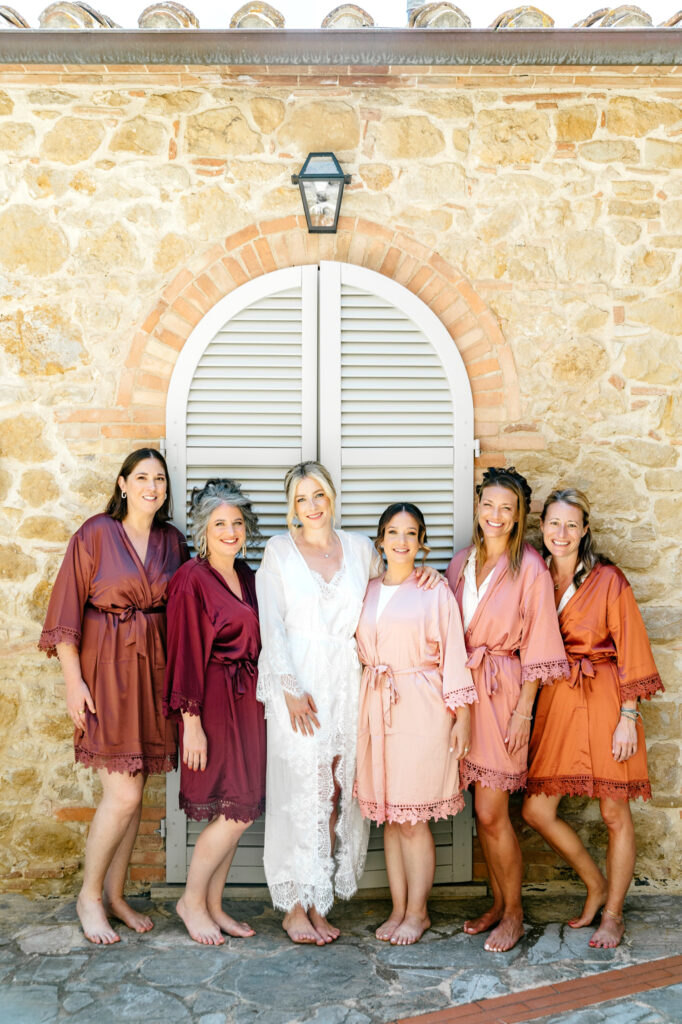 bride with bridesmaids in coordinating silk robes