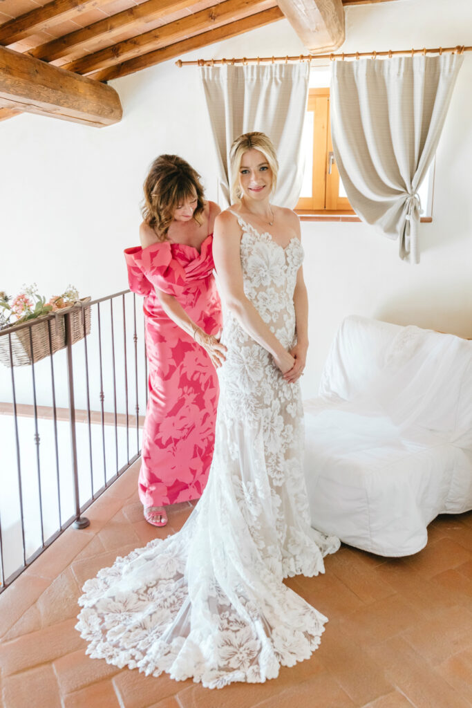 bride getting ready for her Italian wedding day with her mother by Emily Wren Photography