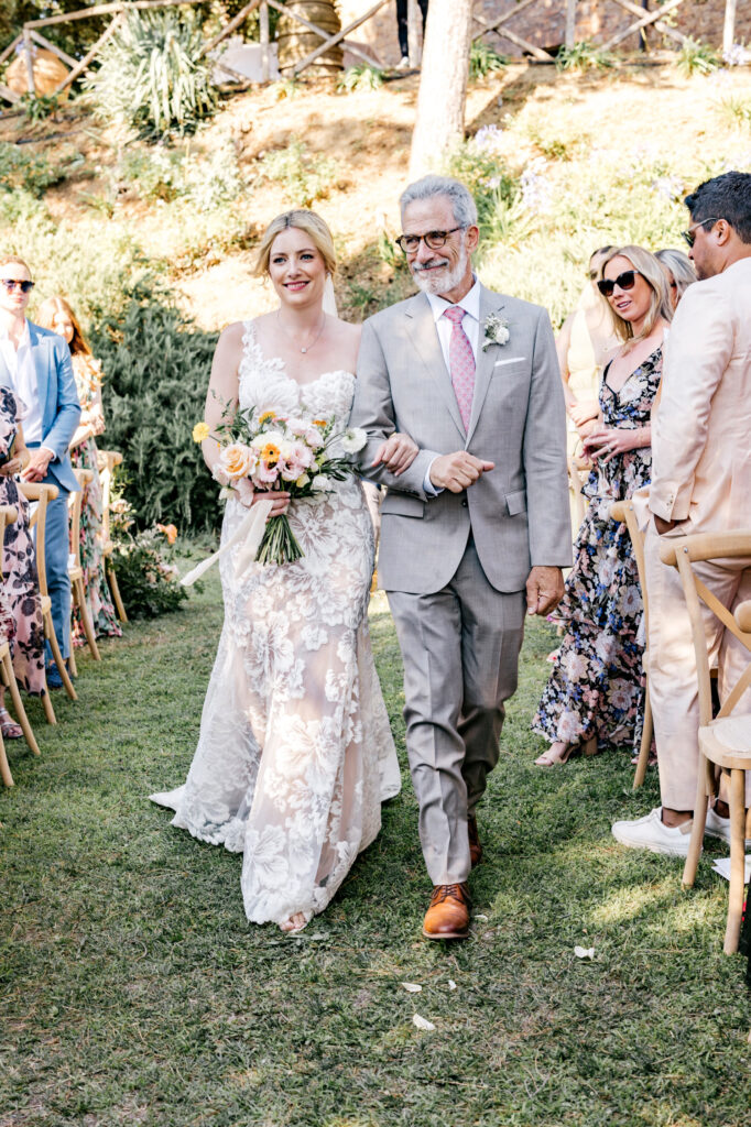 bride walking down the aisle at her Italian wedding summer ceremony by Emily Wren Photography