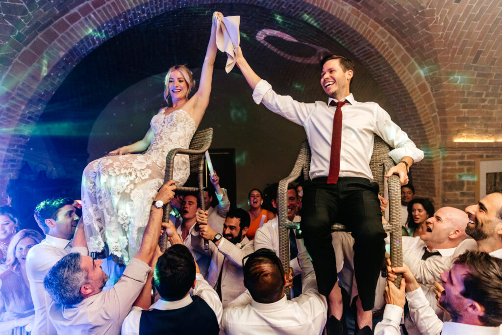 bride & groom during the horra at their Italian wedding reception