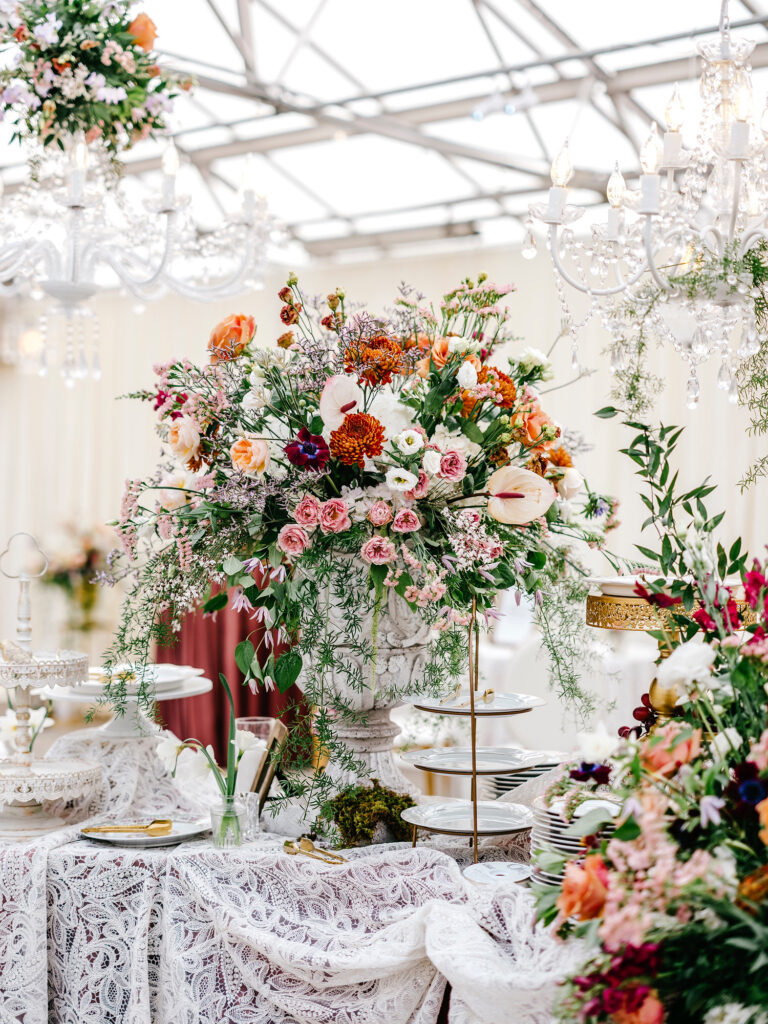 beautiful extravagant floral arrangement for spring wedding table decor by Emily Wren Photography