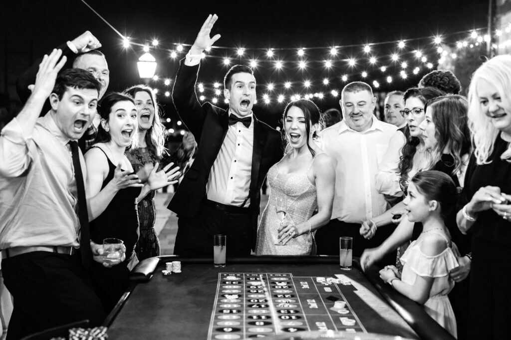 bride & groom playing blackjack at their luxurious Philadelphia wedding