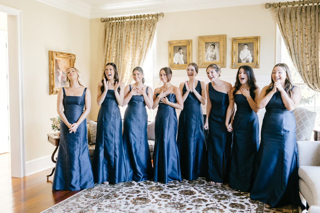 bride's first look with her bridesmaids by Emily Wren Photography