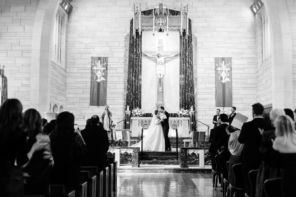 bride & groom's first kiss at St Paul's Catholic Church in Princeton, New Jersey