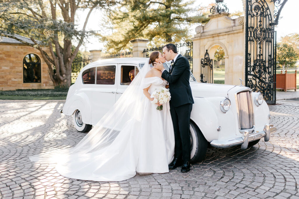 bride & groom portrait in front of vintage Rolls Royce at Jasna Polana