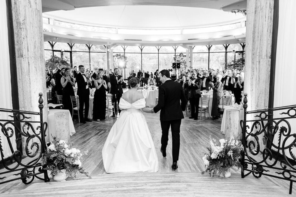 bride & groom entering their Jasna Polana wedding reception
