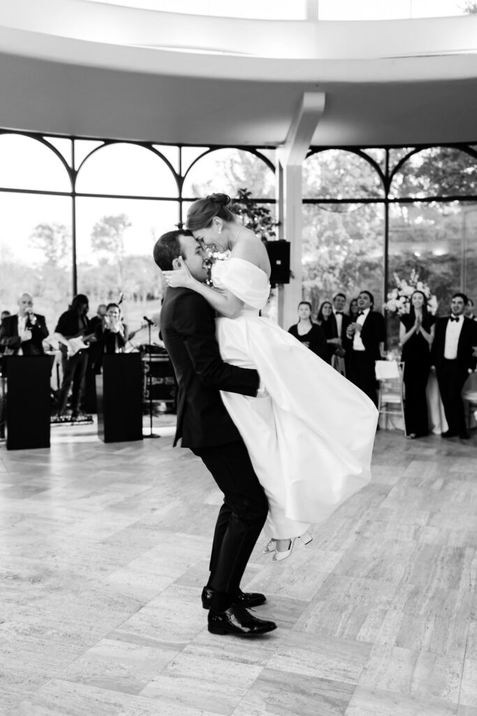 groom lifting his bride during their first dance at their New Jersey wedding reception