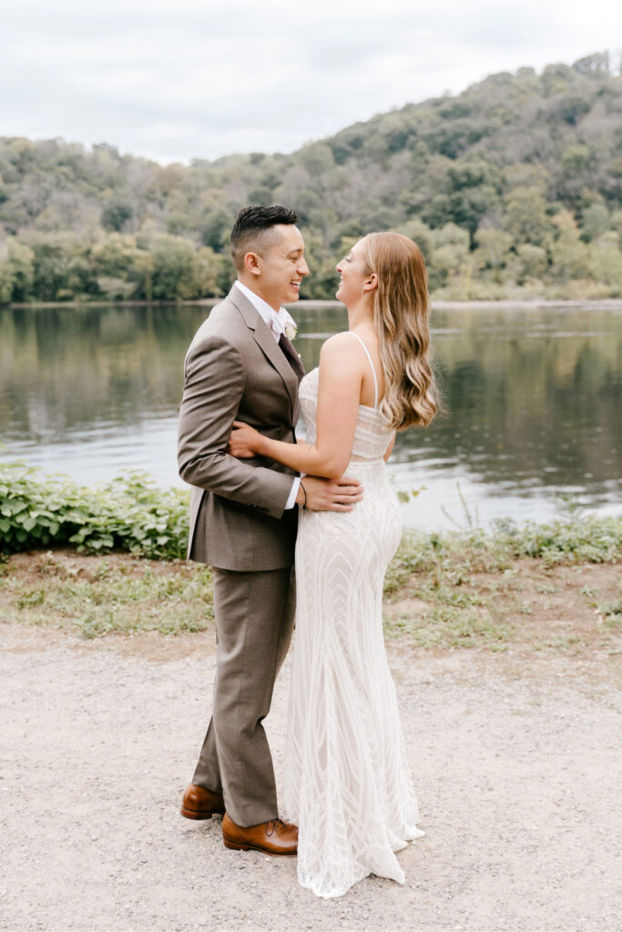 bride & groom's first look along the Delaware river at River House at Odette's