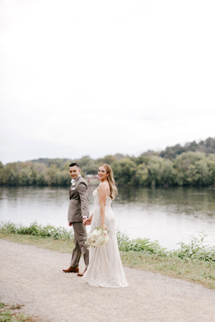 bride & groom wedding portraits on rainy fall wedding day in New Hope