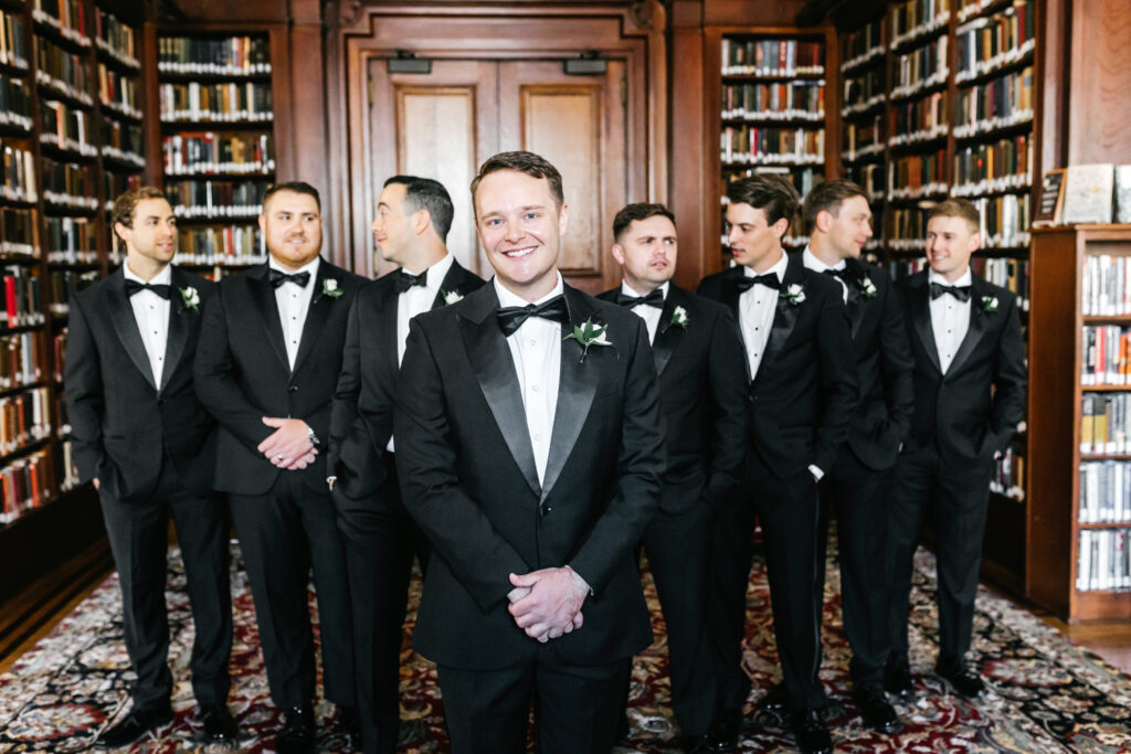 Philadelphia groom with his groomsmen at the Union League library by Emily Wren Photography