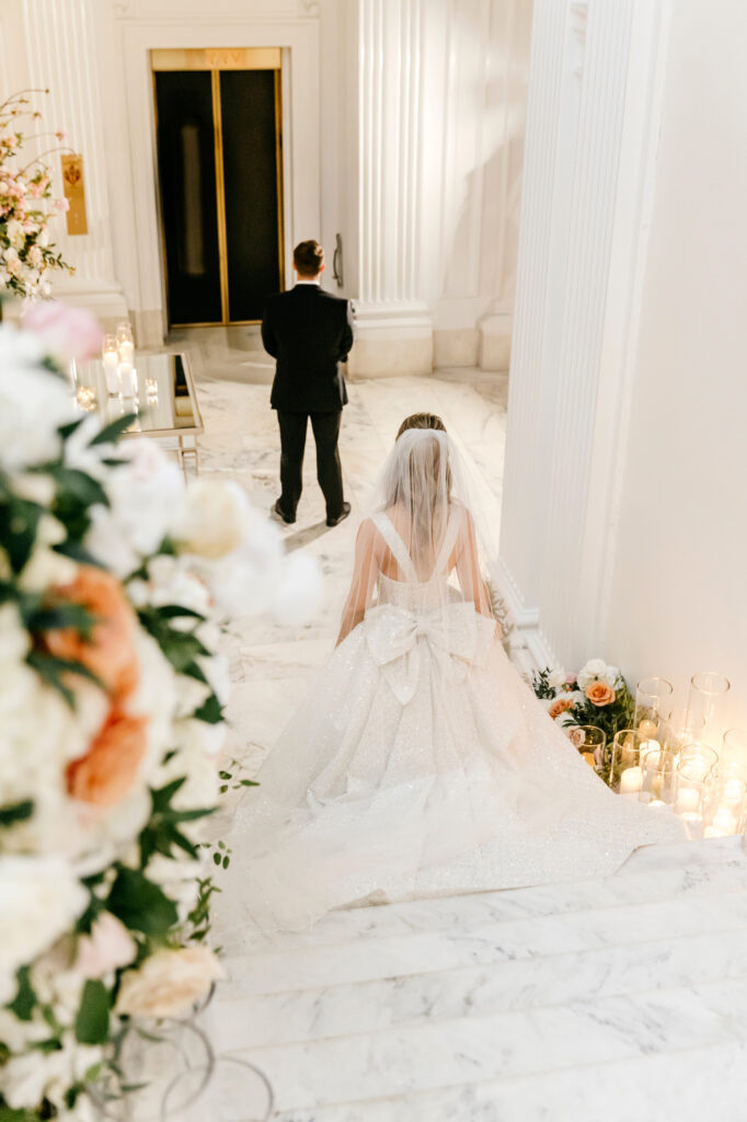 Philadelphia bride walking towards her husband during their private first look at The Union League