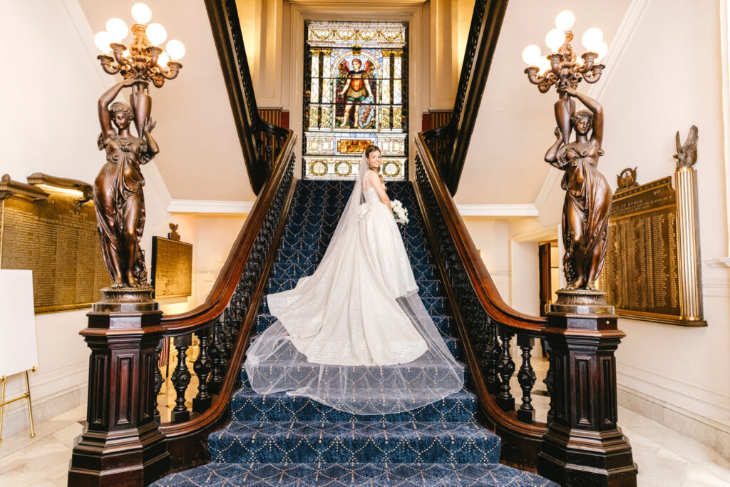 Elegant portrait of Philadelphia bride on the Union League staircase by Emily Wren Photography