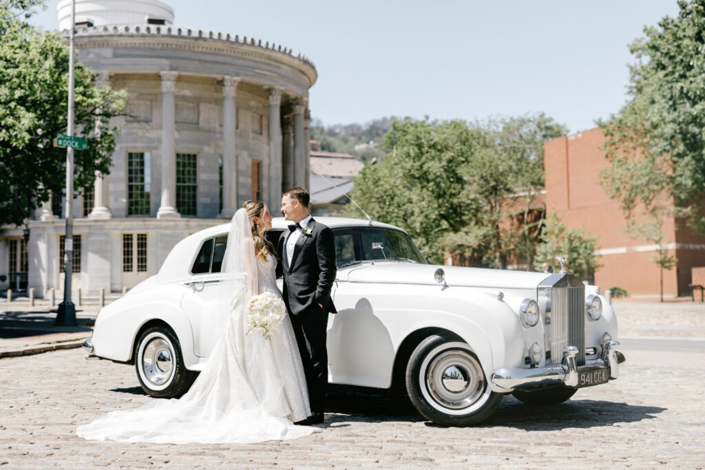 bride & groom with a vintage car at Merchant's Exchange