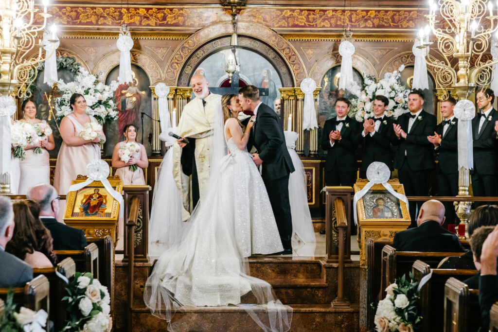 bride & groom's first kiss at their wedding ceremony at St George's Orthodox Cathedral
