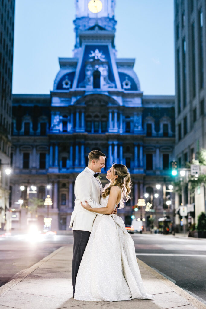 portrait of bride & groom on Broad Street in front of City Hall by Emily Wren Photography