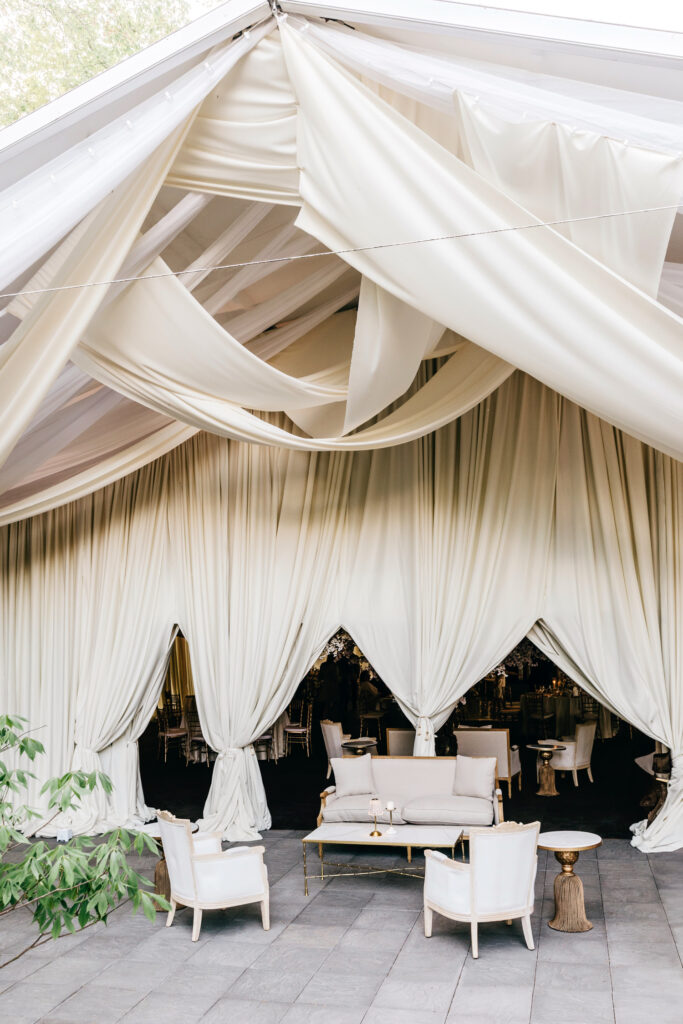 cocktail hour seating with vintage furniture and white drapery or luxurious Pennsylvania wedding