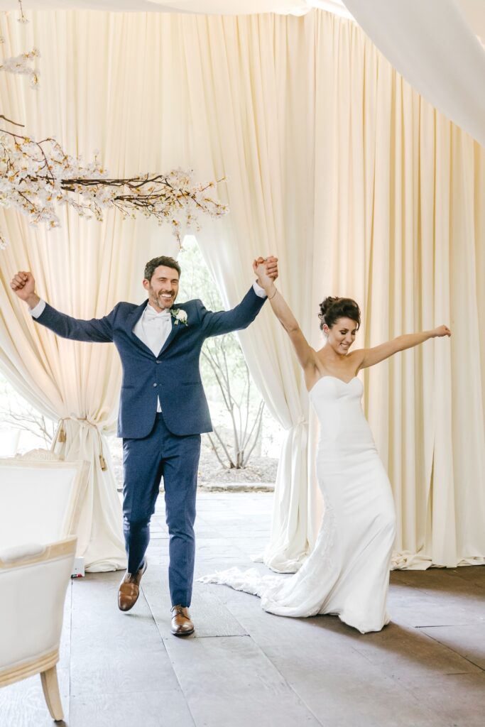 bride & groom entering their luxurious Pennsylvania wedding reception