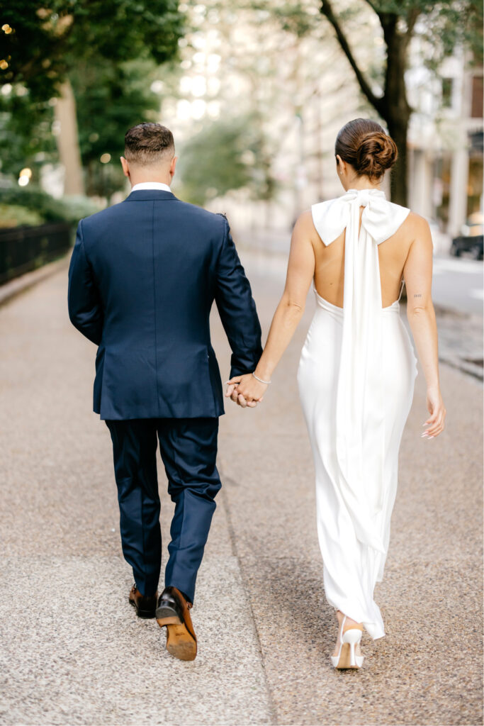 A couple walking through Center City Philadelphia by Emily Wren Photography