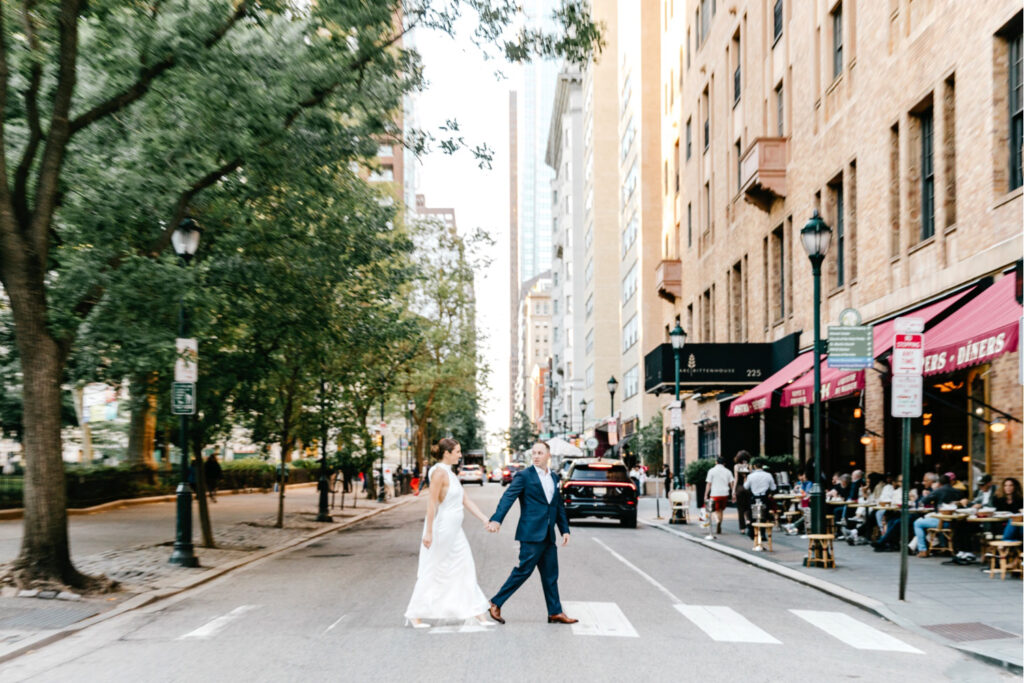 Philadelphia couple walking downtown during summer engagement photoshoot