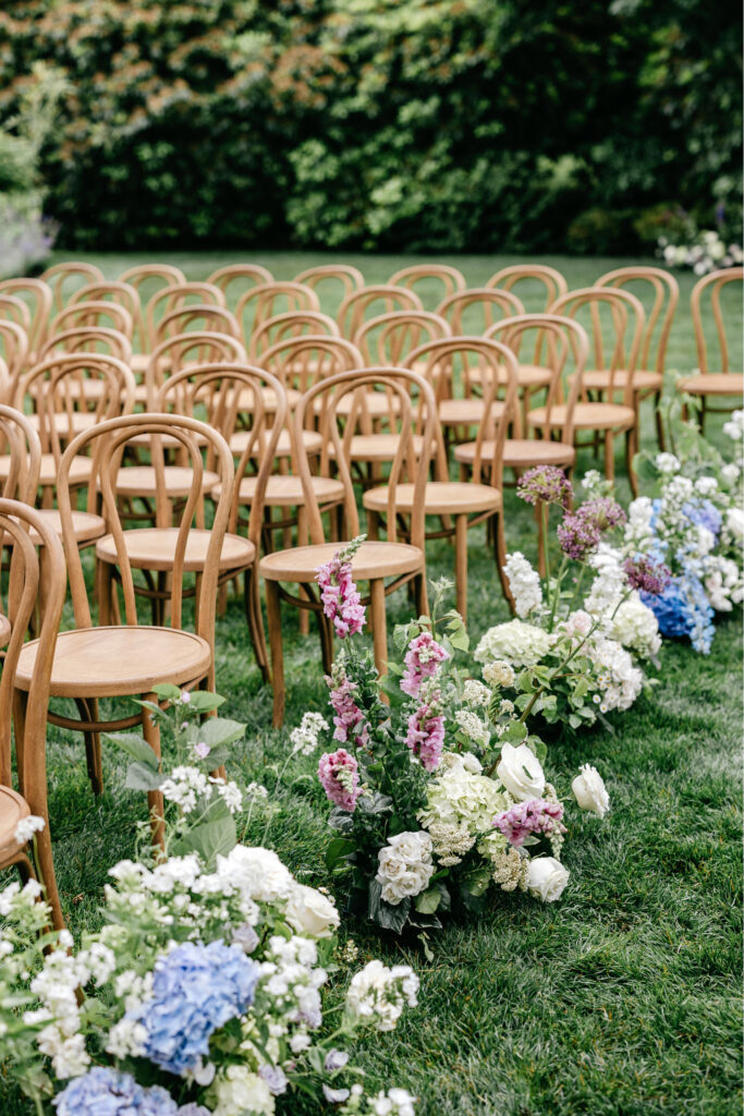 beautiful summer ceremony chair flowers by Emily Wren Photography