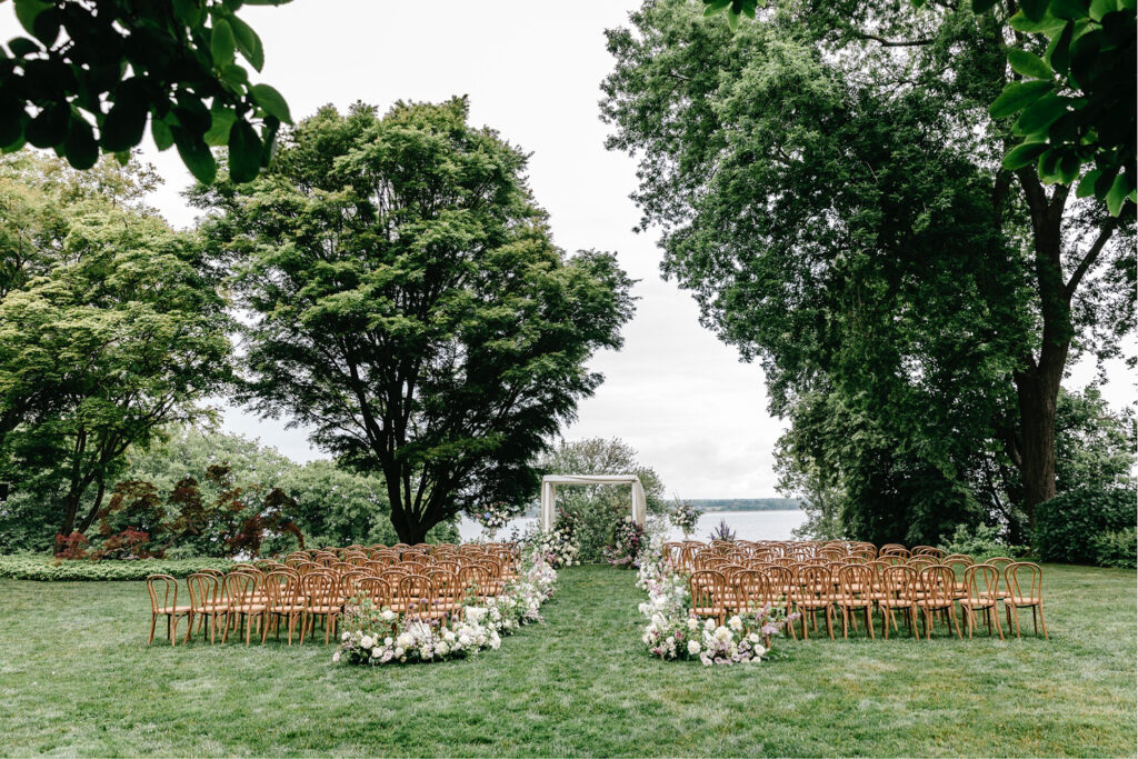 garden wedding ceremony by the river at Glen Manor House in Newport, Rhode Island by New England wedding photographer Emily Wren Photography