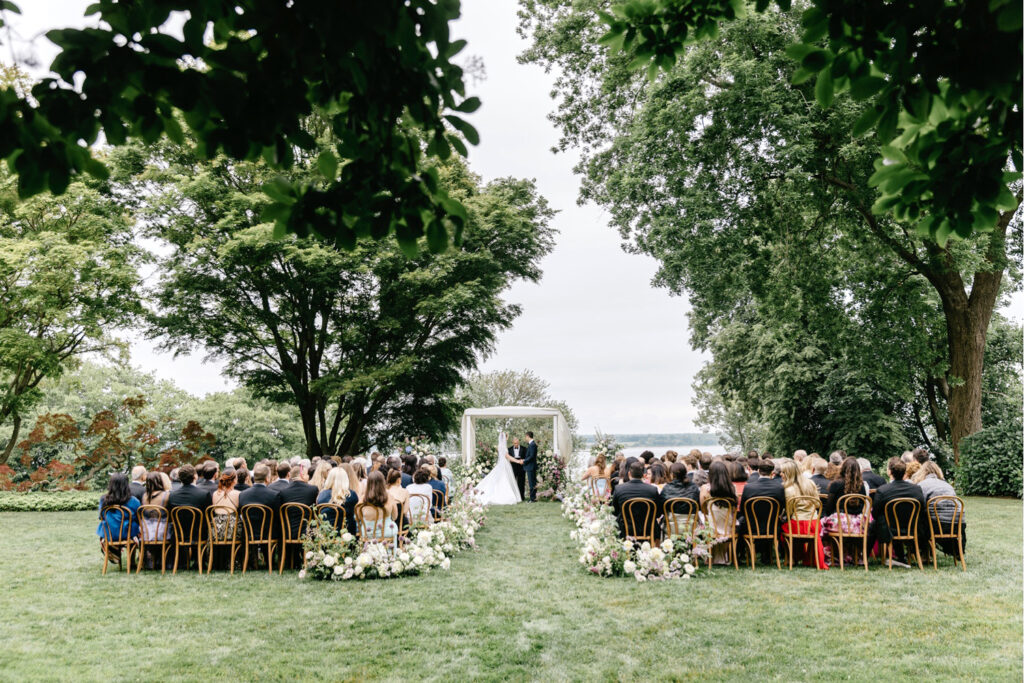 outdoor garden wedding ceremony in Newport, Rhode Island at Glen Manor House by luxurious wedding photographer Emily Wren Photography