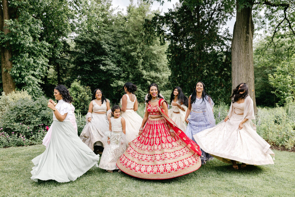 bride with her bridesmaids in traditional indian dresses