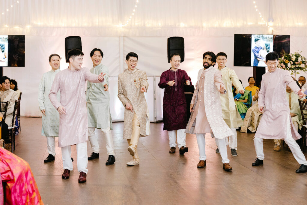 groomsmen dancing at Sangeet ceremony by Emily Wren Photography