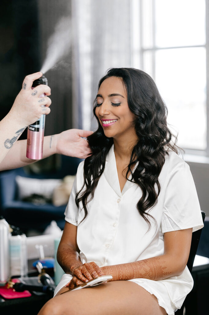 Philadelphia bride getting her makeup done at the Loews Hotel
