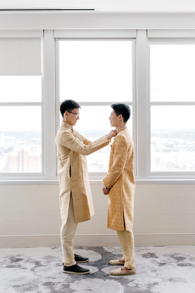 groom getting ready for his multicultural wedding at the Loews Philadelphia Hotel