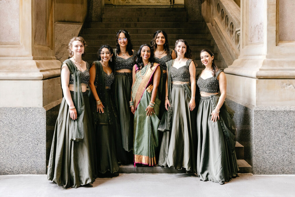 Philadelphia bride with her bridesmaids in traditional Indian wedding attire at City Hall