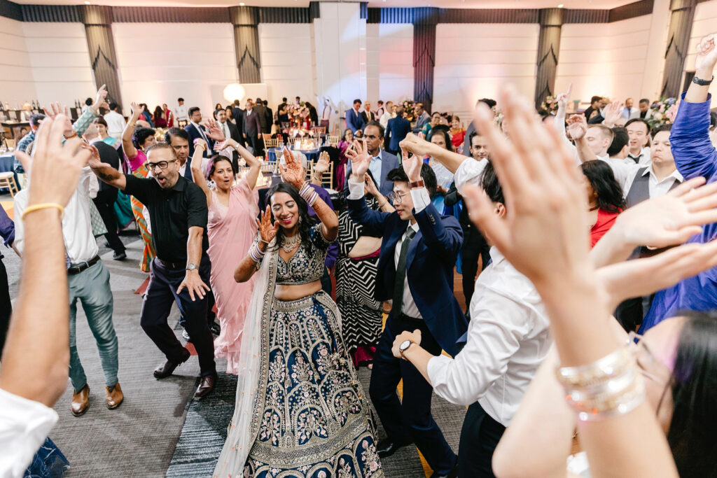 wedding guests dancing and having fun at multicultural wedding reception by Philadelphia wedding photographer Emily Wren Photography