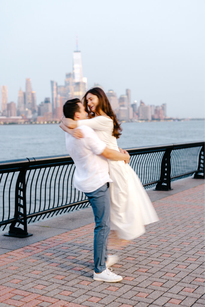 cinematic engagement photoshoot in New Jersey in front of the Manhattan skyline by Emily Wren Photography