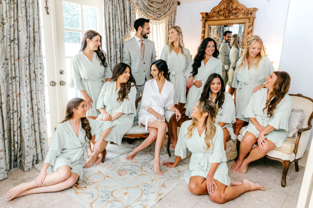 Philadelphia bride with her bridesmaids in matching mint green silk robes at The Inn at Barley Sheaf by Emily Wren Photography