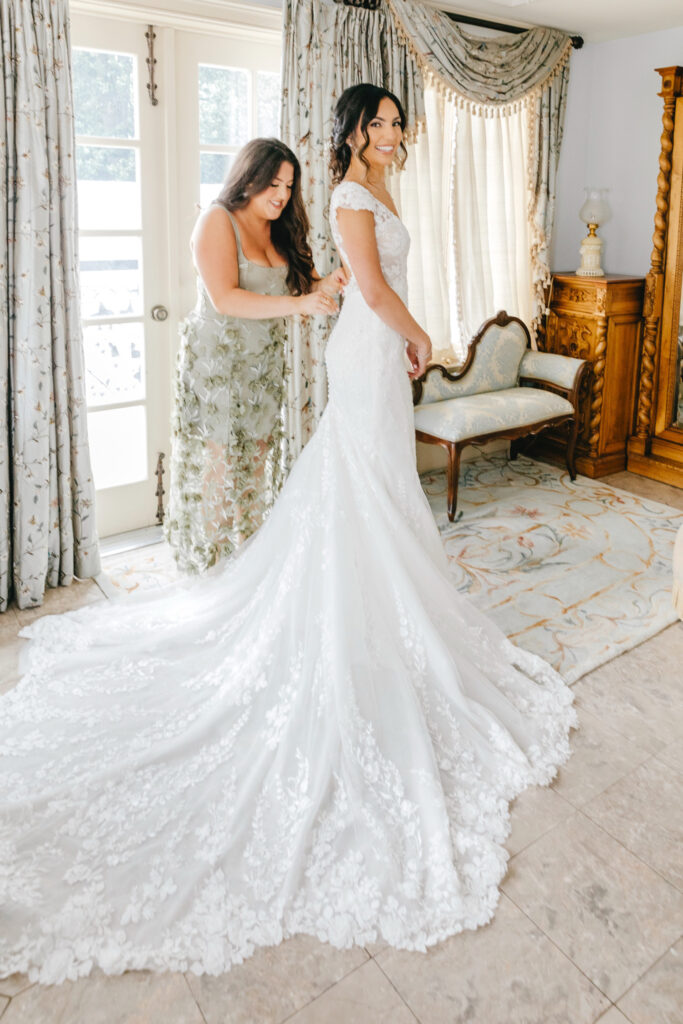 Philadelphia bride getting ready for her summer wedding day with her maid of honor