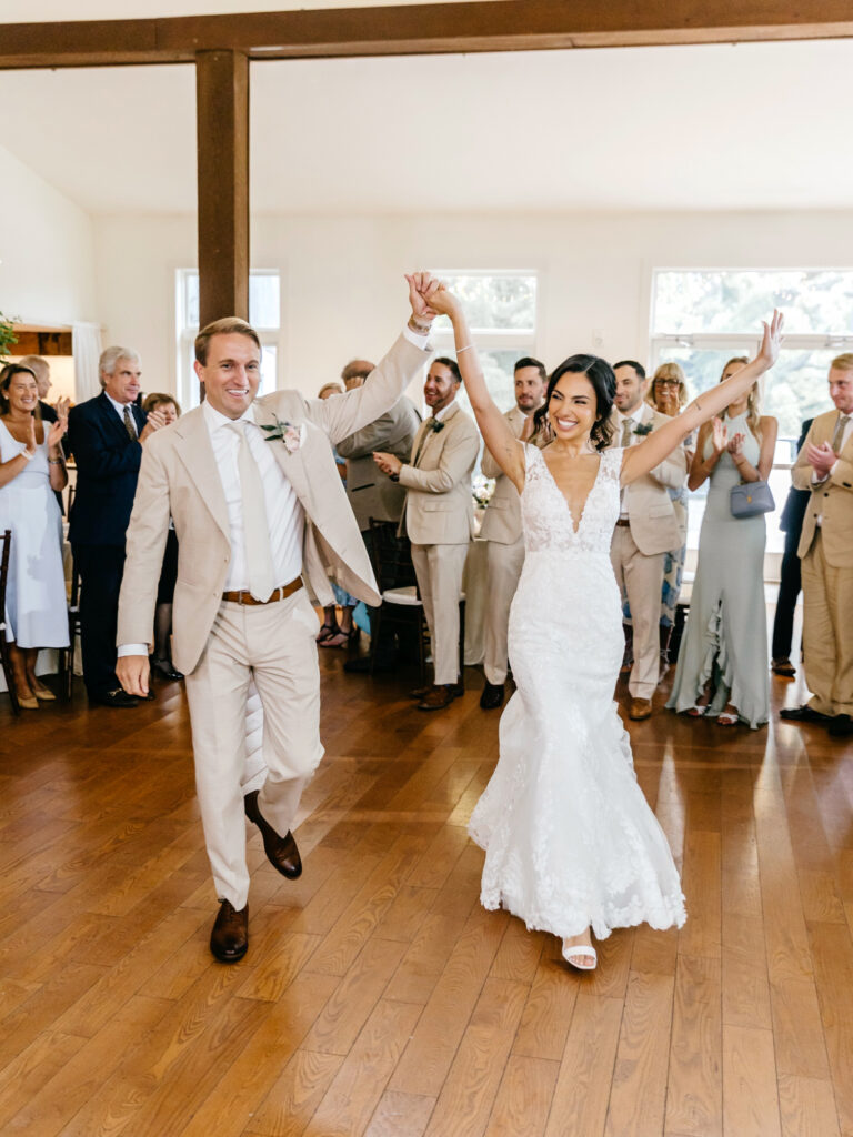 bride and groom entering their wedding reception at the Inn at Barley Sheaf