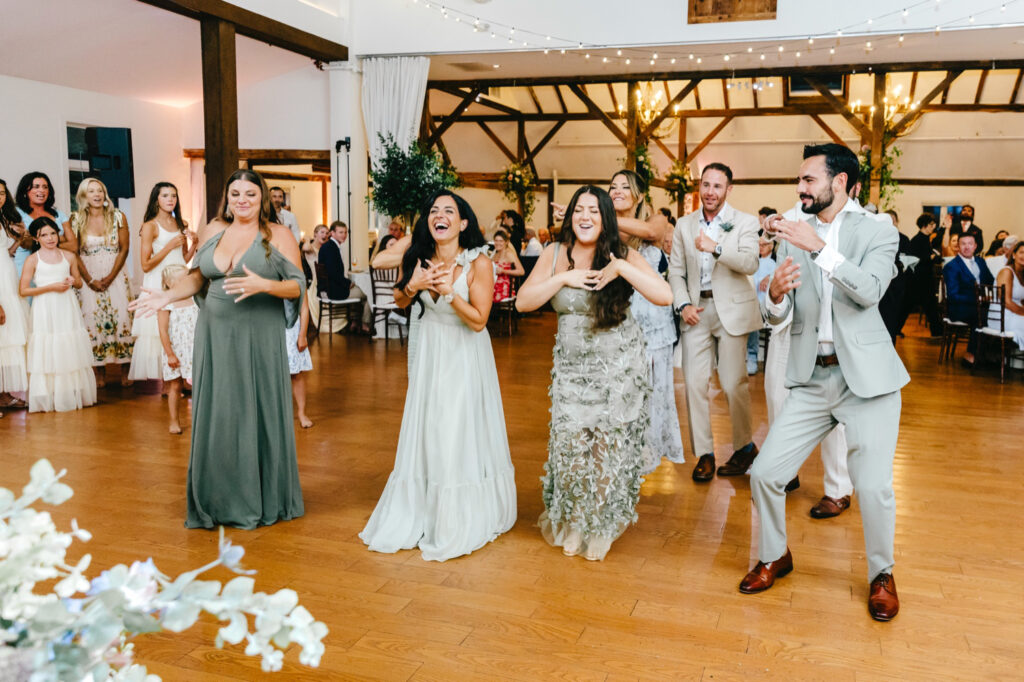 bridesmaids dancing during a summer wedding reception in Philadelphia, Pennsylvania