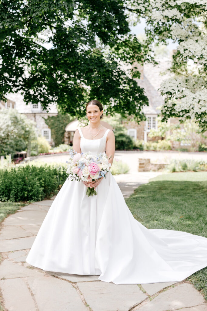 elegant bridal portrait on Spring wedding day in New Jersey holding a pink, blue, and white pastel bridal bouquet