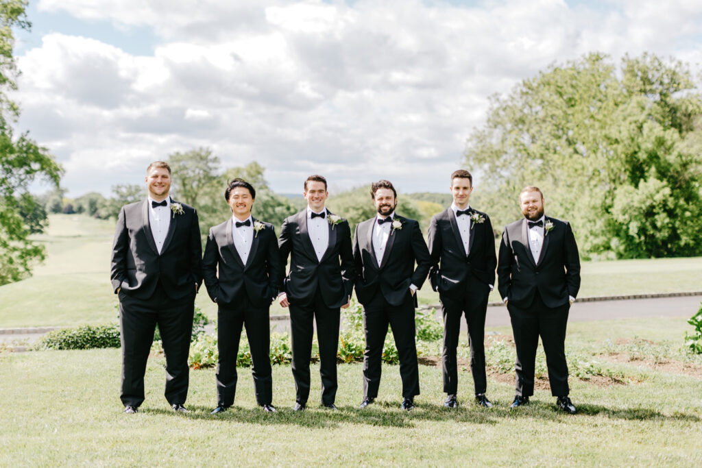 groom with groomsmen in New Jersey garden on Spring wedding day by Emily Wren Photography