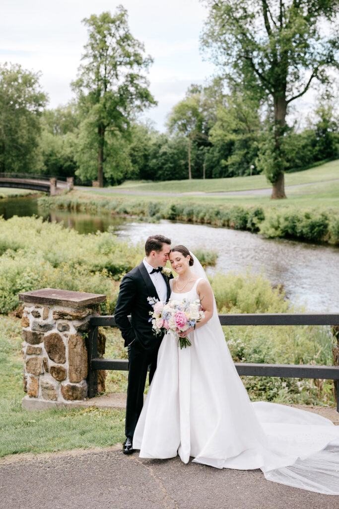 cute portrait of New Jersey bride and groom on their spring wedding day at Fiddler's Elbow