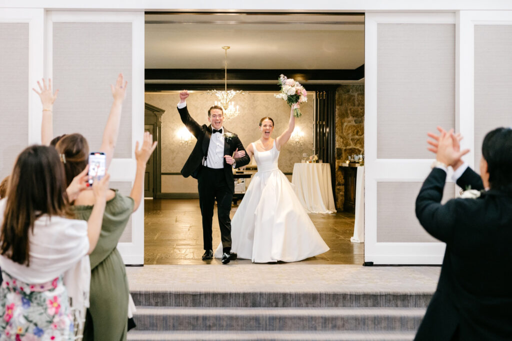New Jersey bride and groom entering their Fiddler's Elbow wedding reception