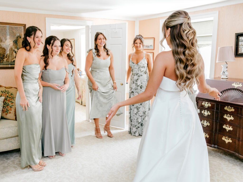 bride's first look with her bridesmaids during her summer wedding day in Bryn Mawr, PA