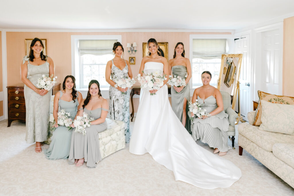 Pennsylvania bride with her bridesmaids in matching silk sage green bridesmaid dresses