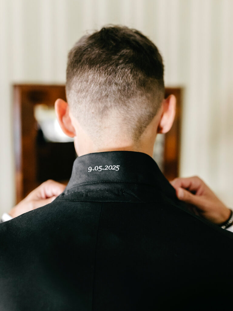 wedding date stitched on grooms tuxedo by Emily Wren Photography