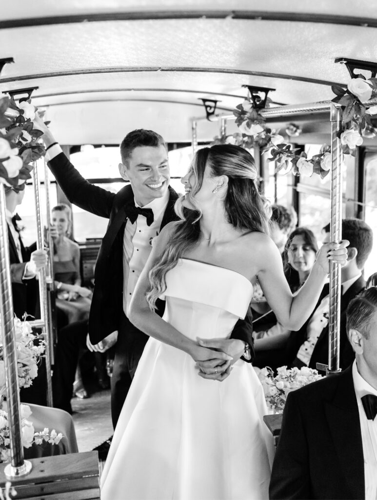 bride and groom riding party bus on their way to their summer church ceremony
