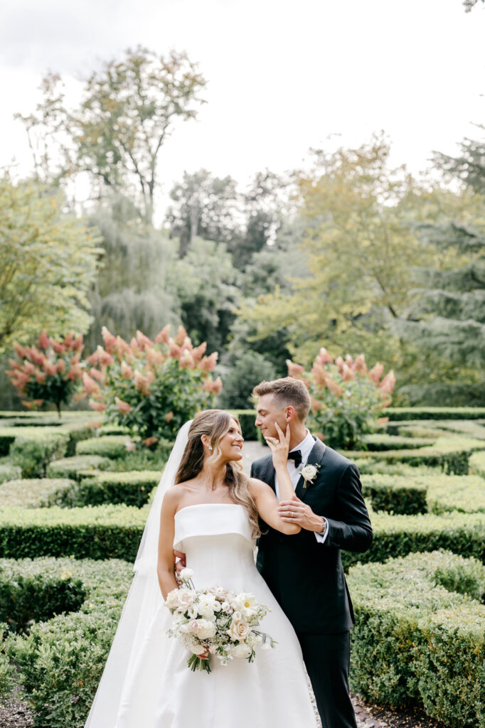 beautiful portrait of a bride and groom in an elegant summer garden in Pennsylvania