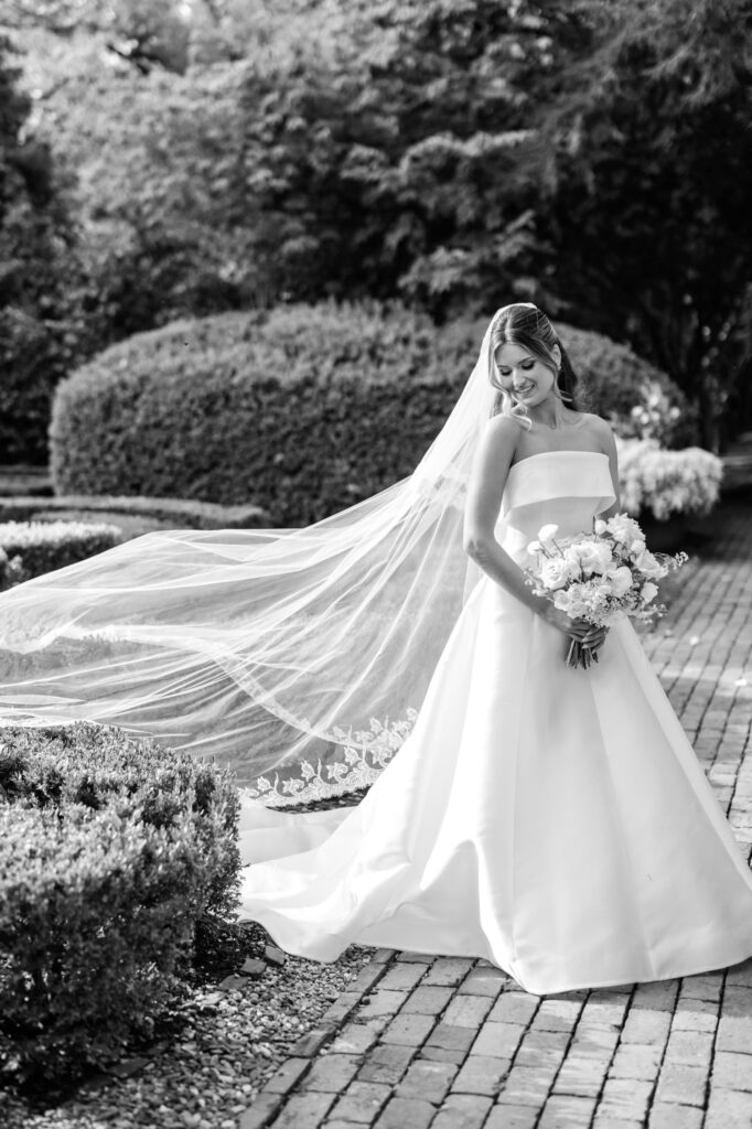 stunning portrait of Pennsylvania bride on her summer wedding day in a secret garden