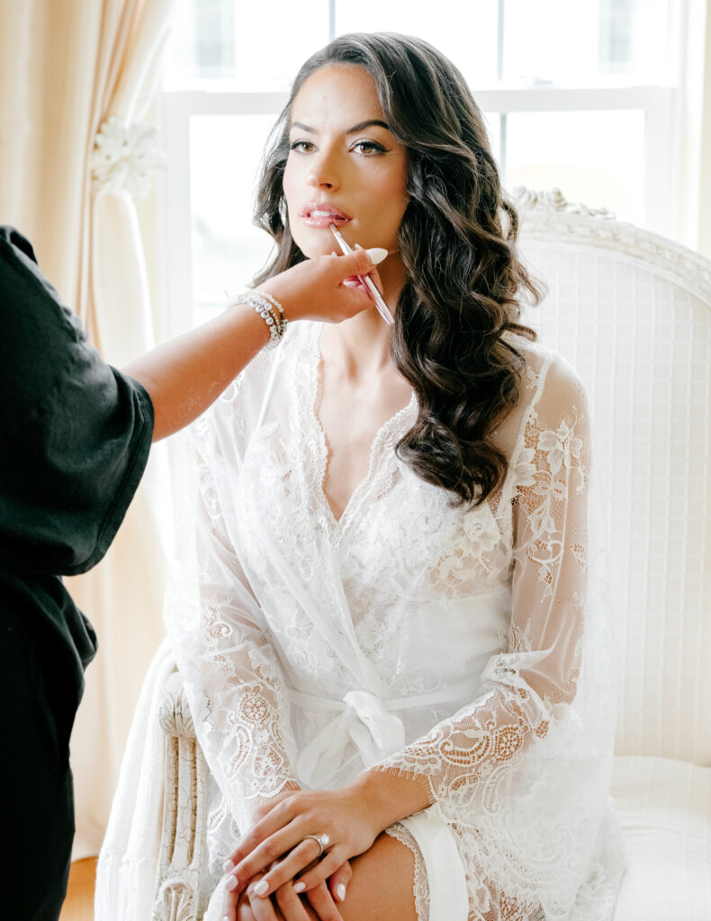 Philadelphia bride getting her makeup done for her Center City wedding day
