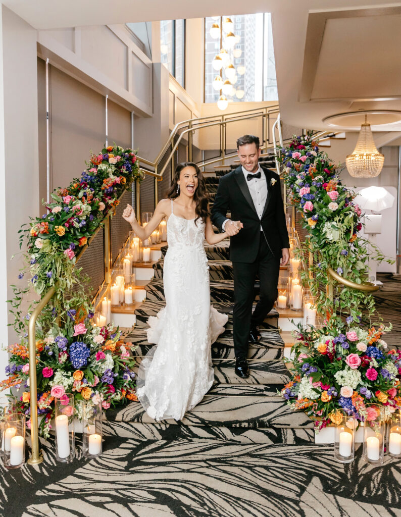 Philadelphia bride and groom entering their luxurious wedding reception at The Lucy by Cescaphe